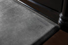 An up-close shot of a Linen Onyx WellnessMat in front a of a dark brown vanity.