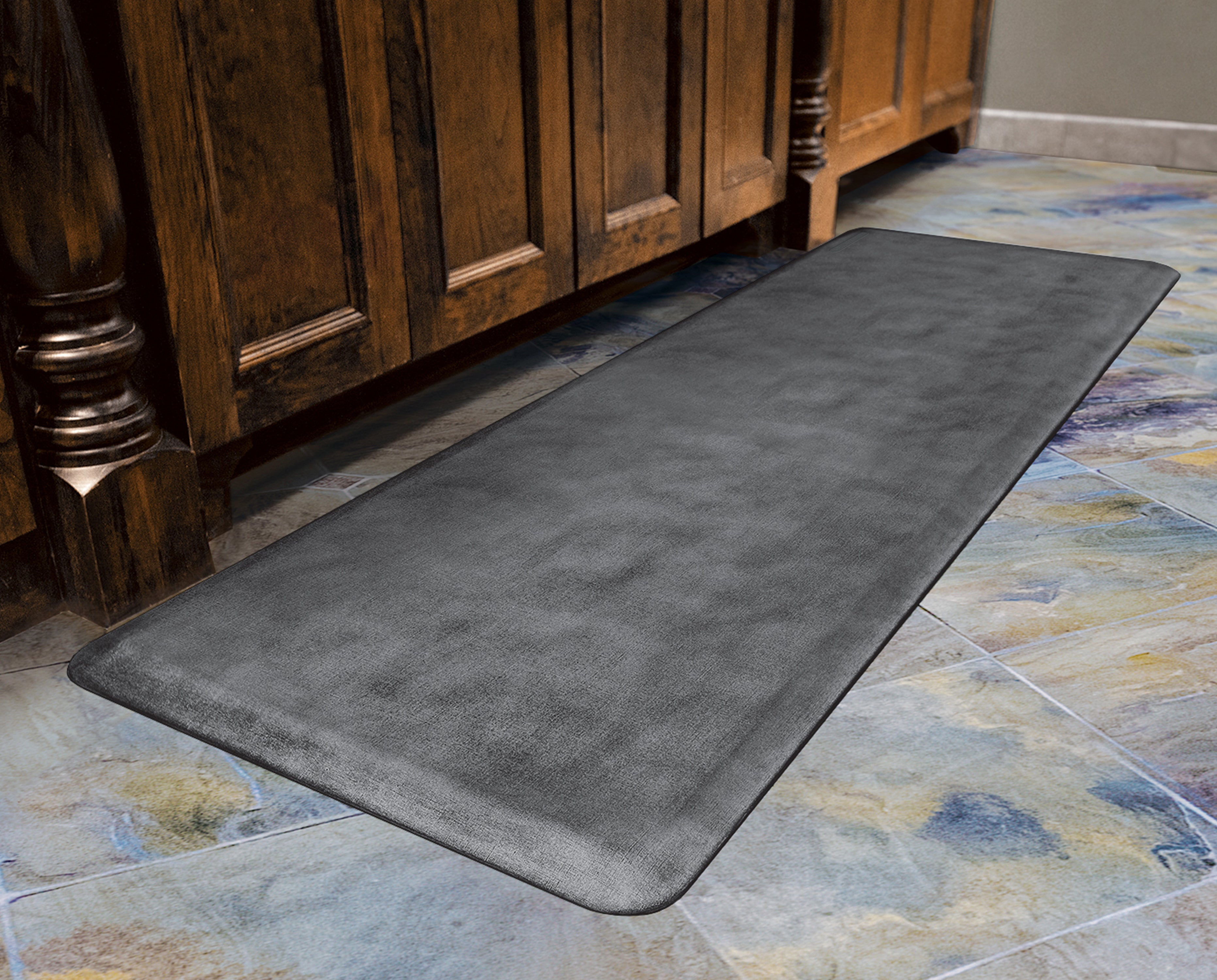 A 6'x2' Linen Slate WellnessMat in a tile floor kitchen. 