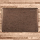 A 3'x2' Antique Light WellnessMat on a light wood floor.